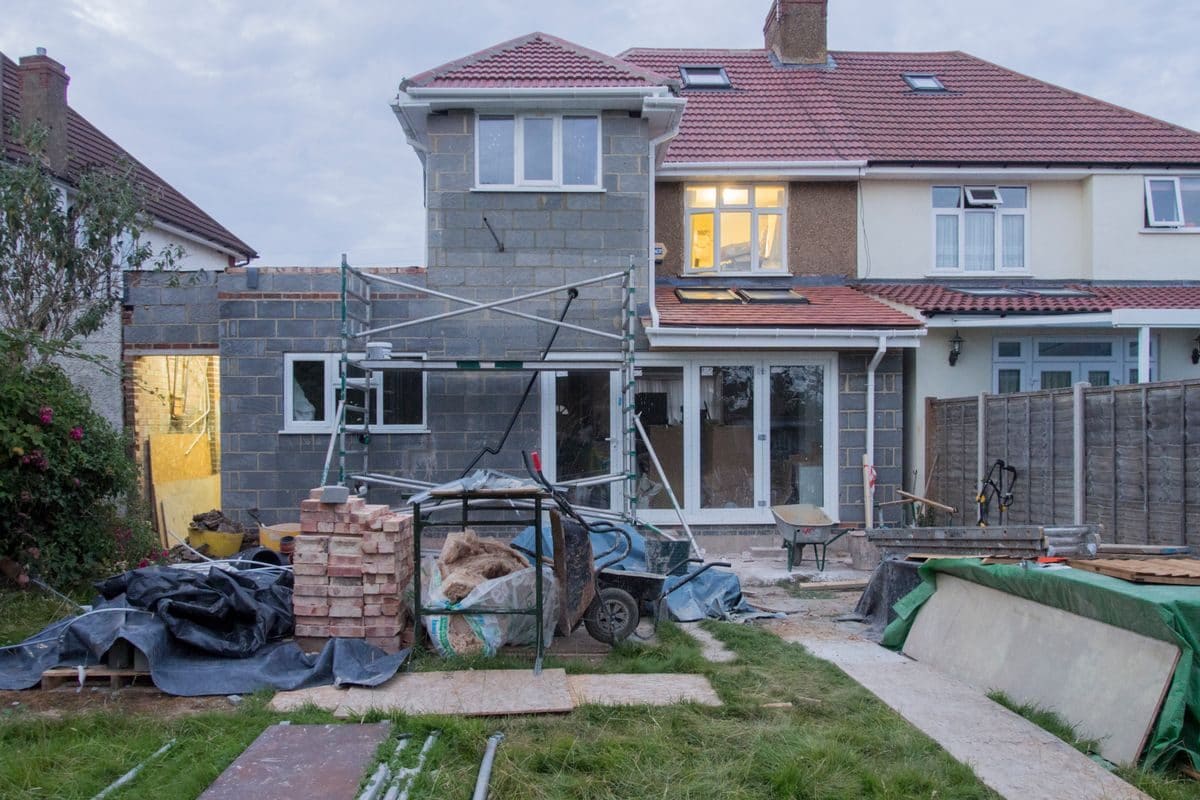 A rear house extension under construction with blockwork and scaffolding