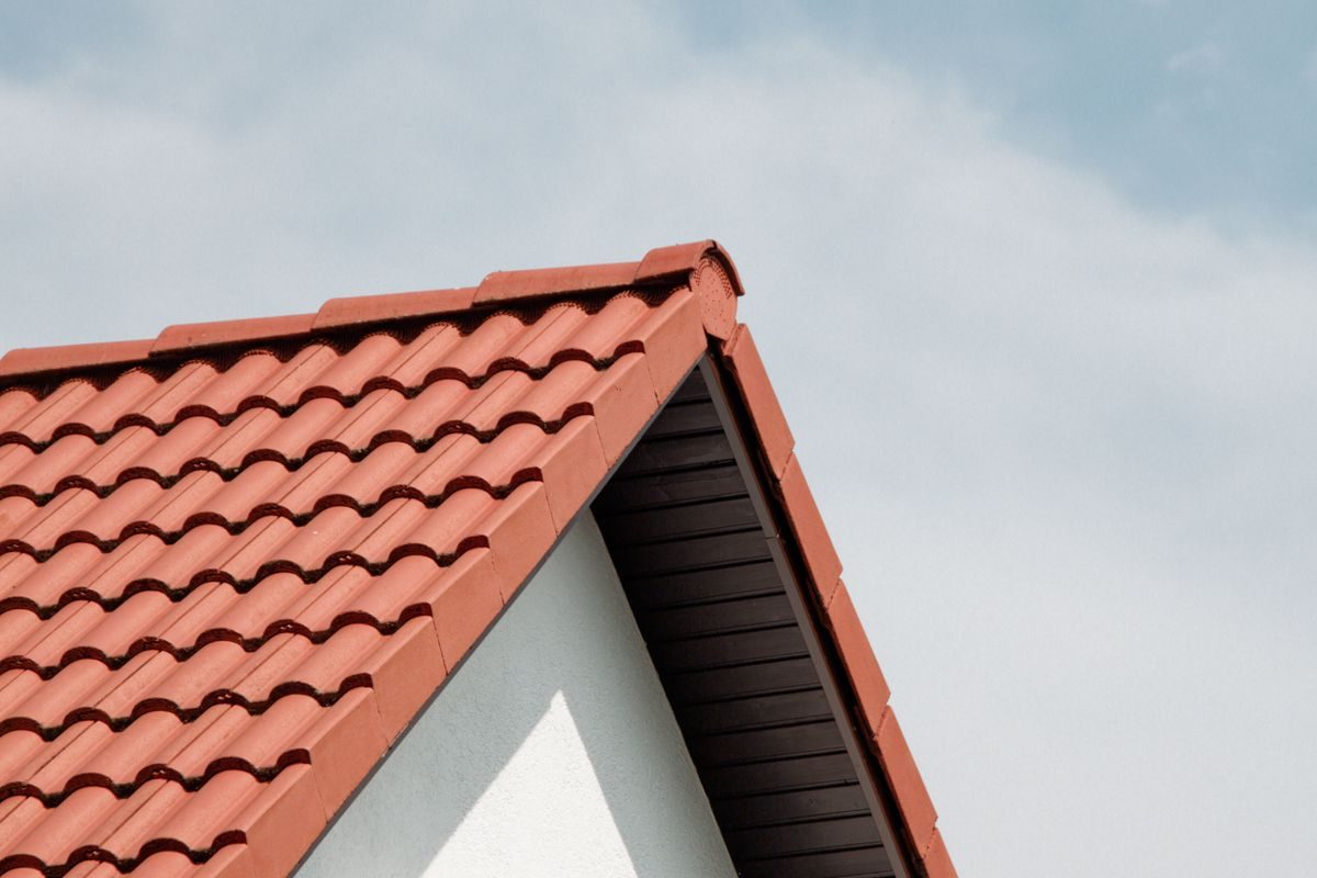 A tiled pitched roof with fascias and soffits